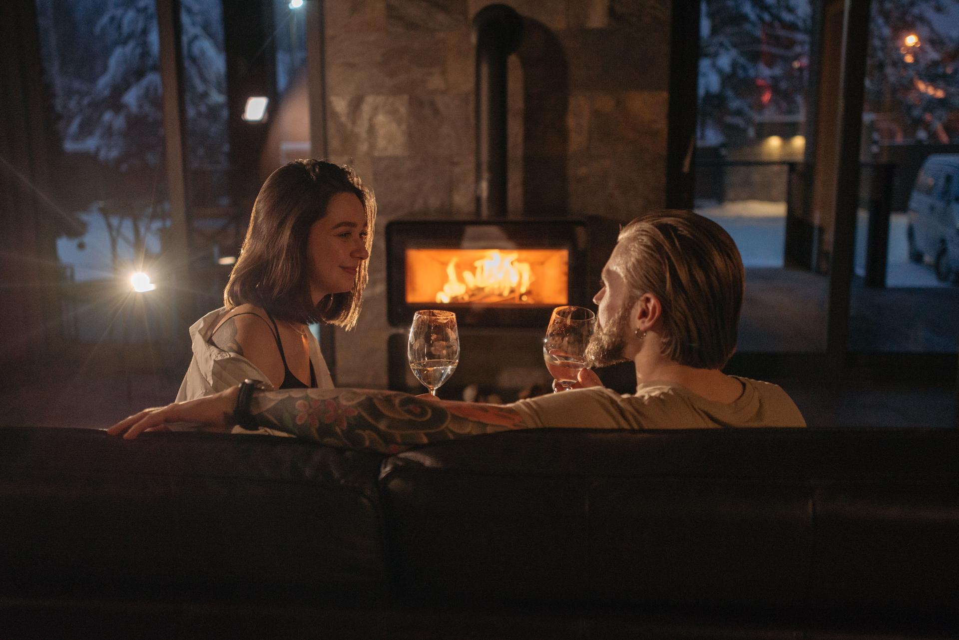 Couple-Chalet-Fireplace-Wine